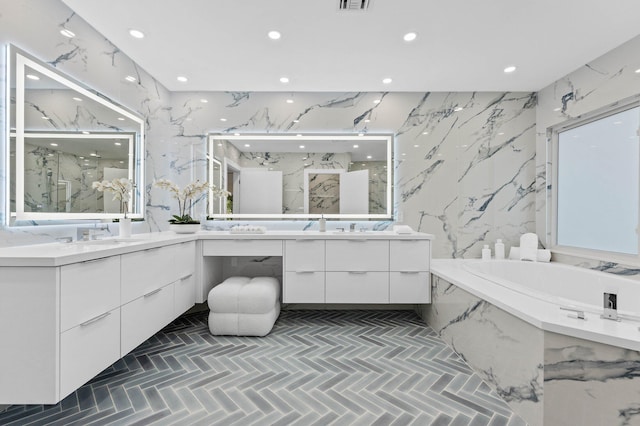 2646 NW 49th St, Boca Raton, FL 33434 - full bathroom featuring stone wall, recessed lighting, a marble finish shower, and two vanities