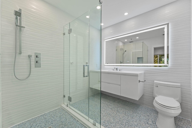 2646 NW 49th St, Boca Raton, FL 33434 - full bath with tile patterned flooring, a stall shower, vanity, toilet, and tile walls