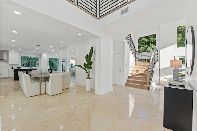 2646 NW 49th St, Boca Raton, FL 33434 - living area featuring stairs, light marble finish floors, recessed lighting, and a high ceiling