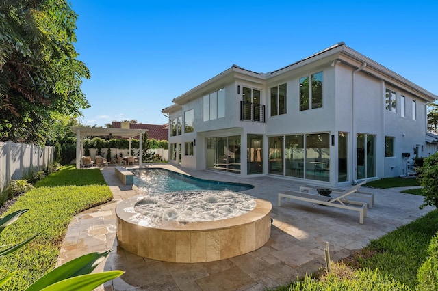 2646 NW 49th St, Boca Raton, FL 33434 - rear view of property with stucco siding, a pergola, a fenced backyard, an outdoor hot tub, and a patio