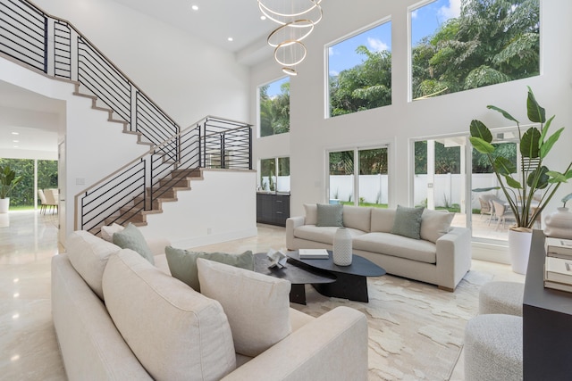 2646 NW 49th St, Boca Raton, FL 33434 - living area featuring a towering ceiling, stairway, recessed lighting, marble tiled floors, and a chandelier