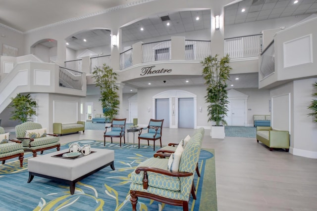 common area with a towering ceiling and recessed lighting