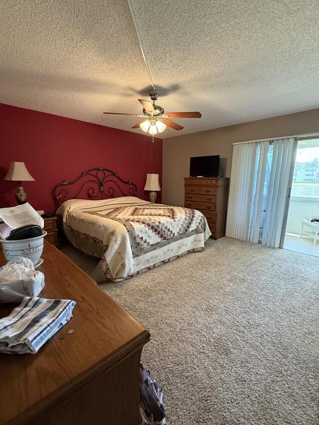 1008 Wolverton A, Boca Raton, FL 33434 - bedroom featuring carpet, a textured ceiling, access to exterior, and a ceiling fan