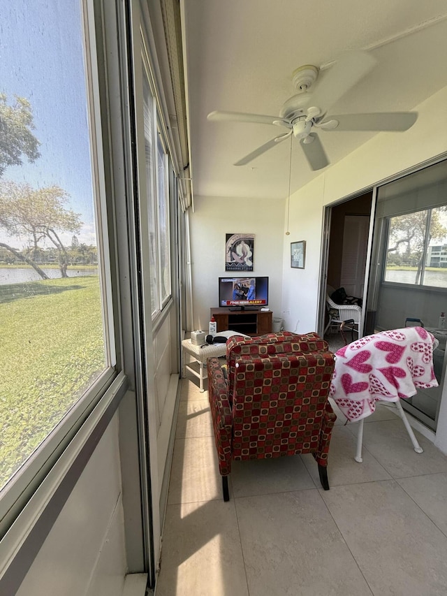 1008 Wolverton A, Boca Raton, FL 33434 - sunroom / solarium featuring a ceiling fan and a water view