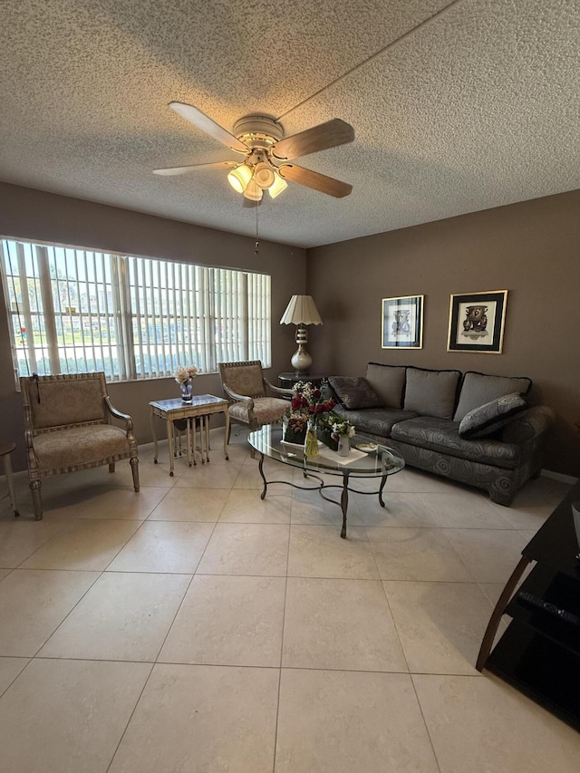 1008 Wolverton A, Boca Raton, FL 33434 - tiled living room with a textured ceiling and ceiling fan