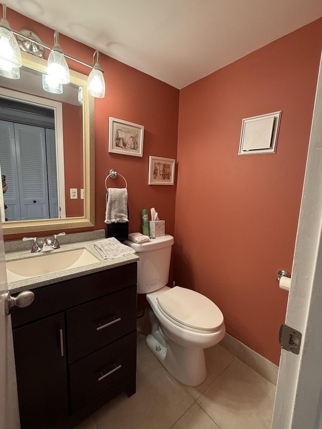 1008 Wolverton A, Boca Raton, FL 33434 - half bathroom featuring toilet, vanity, and tile patterned floors