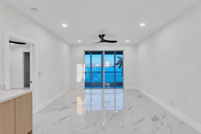 100 Paradise Harbour Blvd Unit 502, North Palm Beach, FL 33408 - spare room with light marble finish flooring, recessed lighting, baseboards, and a smoke detector