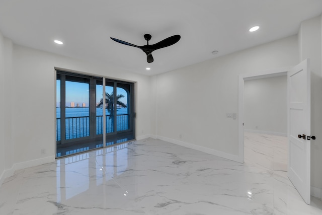 100 Paradise Harbour Blvd Unit 502, North Palm Beach, FL 33408 - spare room with a ceiling fan, marble finish flooring, baseboards, and recessed lighting