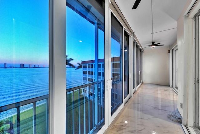 100 Paradise Harbour Blvd Unit 502, North Palm Beach, FL 33408 - balcony featuring a ceiling fan and a water view