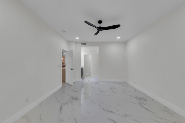 100 Paradise Harbour Blvd Unit 502, North Palm Beach, FL 33408 - spare room featuring a ceiling fan, light marble finish flooring, baseboards, and recessed lighting
