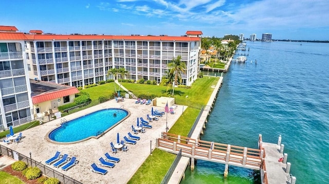 100 Paradise Harbour Blvd Unit 502, North Palm Beach, FL 33408 - community pool featuring a water view and a patio