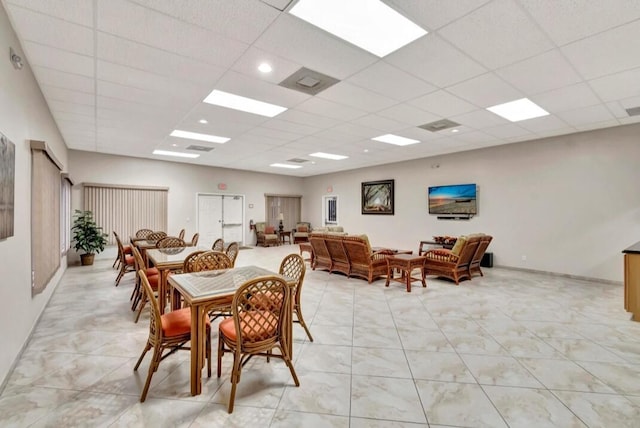 100 Paradise Harbour Blvd Unit 502, North Palm Beach, FL 33408 - dining area featuring a drop ceiling and baseboards