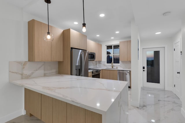 100 Paradise Harbour Blvd Unit 502, North Palm Beach, FL 33408 - kitchen featuring stainless steel appliances, a peninsula, modern cabinets, light stone countertops, and recessed lighting