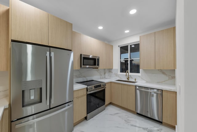 100 Paradise Harbour Blvd Unit 502, North Palm Beach, FL 33408 - kitchen featuring appliances with stainless steel finishes, light brown cabinets, light marble finish floors, a sink, and recessed lighting