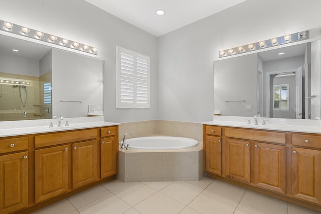 17009 SW Sapri Way, Port Saint Lucie, FL 34986 - full bath with a shower stall, tile patterned flooring, a bath, and two vanities