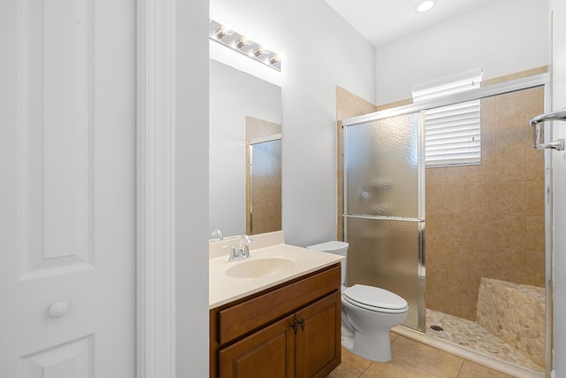 17009 SW Sapri Way, Port Saint Lucie, FL 34986 - full bath with a stall shower, toilet, tile patterned floors, and vanity