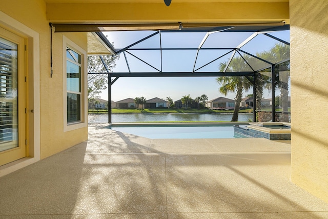17009 SW Sapri Way, Port Saint Lucie, FL 34986 - view of pool with a patio area, a water view, a lanai, a pool with connected hot tub, and a residential view