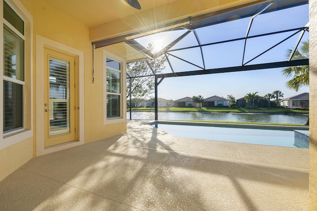 17009 SW Sapri Way, Port Saint Lucie, FL 34986 - view of patio featuring a lanai, a water view, and an outdoor pool