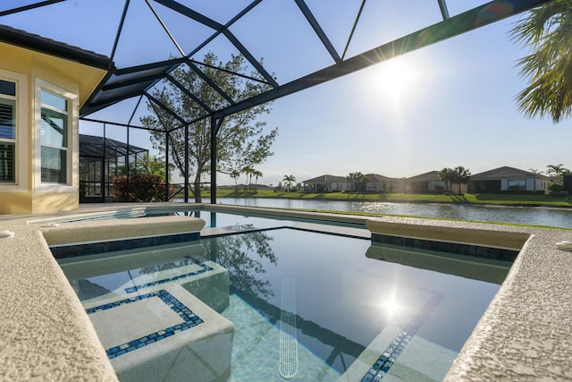 17009 SW Sapri Way, Port Saint Lucie, FL 34986 - view of swimming pool with a water view, a lanai, a pool with connected hot tub, and a patio area