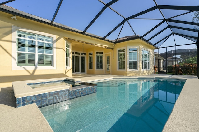 17009 SW Sapri Way, Port Saint Lucie, FL 34986 - view of pool with a patio, glass enclosure, a pool with connected hot tub, and ceiling fan