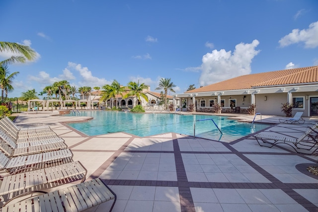 17009 SW Sapri Way, Port Saint Lucie, FL 34986 - community pool with a patio area