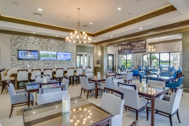 17009 SW Sapri Way, Port Saint Lucie, FL 34986 - dining area with a chandelier, crown molding, an accent wall, recessed lighting, and wallpapered walls