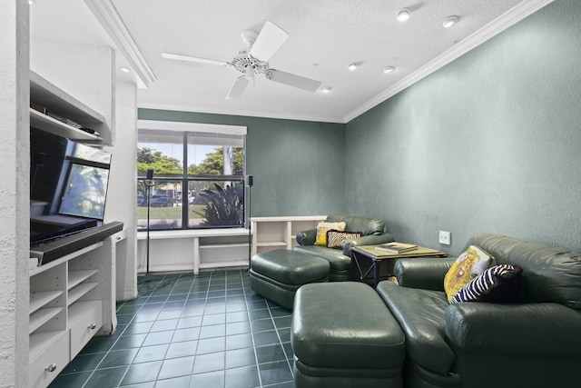 living area featuring crown molding, dark tile patterned floors, ceiling fan, a textured ceiling, and a textured wall