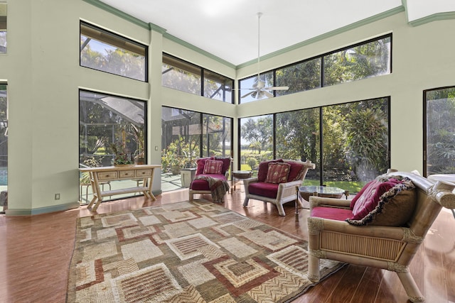 sunroom / solarium featuring an outdoor hangout area, plenty of natural light, and a ceiling fan