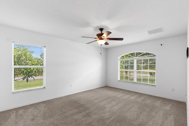 1042 SW Janette Ave, Port Saint Lucie, FL 34953 - carpeted spare room featuring ceiling fan and baseboards