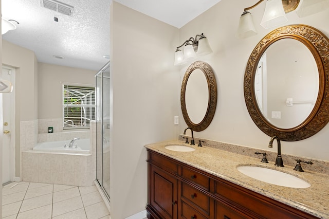 1042 SW Janette Ave, Port Saint Lucie, FL 34953 - bathroom with a bath, tile patterned floors, double vanity, a stall shower, and a textured ceiling