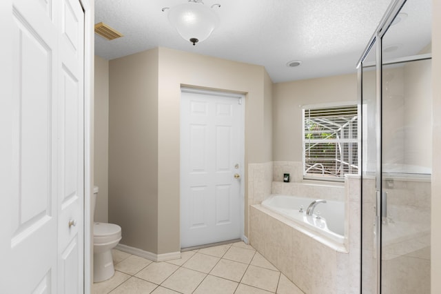 1042 SW Janette Ave, Port Saint Lucie, FL 34953 - bathroom with a textured ceiling, a bath, tile patterned floors, and a shower stall