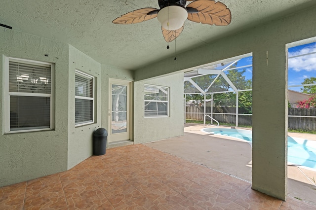 1042 SW Janette Ave, Port Saint Lucie, FL 34953 - fenced backyard with a patio, a lanai, and ceiling fan