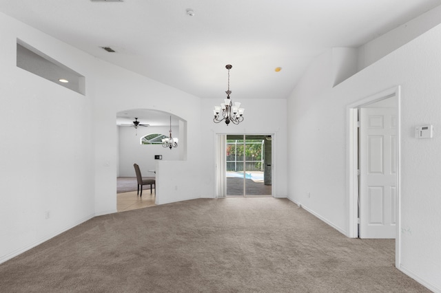 1042 SW Janette Ave, Port Saint Lucie, FL 34953 - empty room featuring a chandelier, light carpet, and a ceiling fan