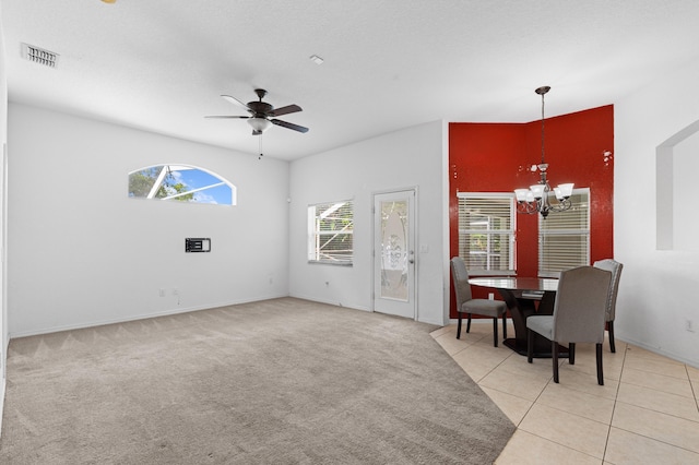 1042 SW Janette Ave, Port Saint Lucie, FL 34953 - living room with a chandelier, ceiling fan, and light carpet