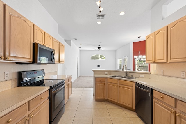 1042 SW Janette Ave, Port Saint Lucie, FL 34953 - kitchen featuring stainless steel appliances, light colored carpet, light tile patterned floors, light countertops, and recessed lighting