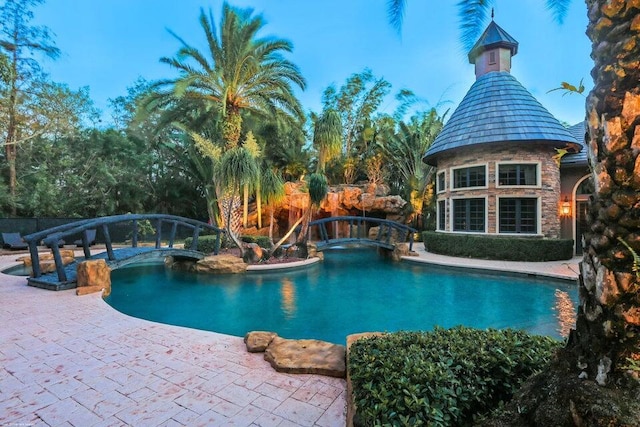 outdoor pool featuring a patio