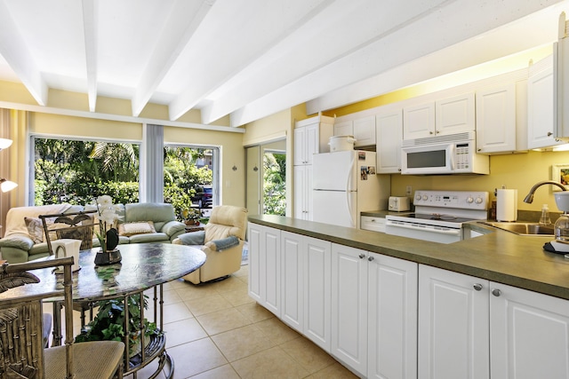 4001 S Ocean Blvd Unit 118, South Palm Beach, FL 33480 - kitchen featuring white appliances, a sink, open floor plan, beam ceiling, and dark countertops