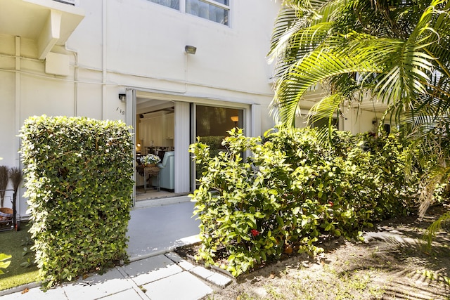 4001 S Ocean Blvd Unit 118, South Palm Beach, FL 33480 - view of exterior entry featuring stucco siding