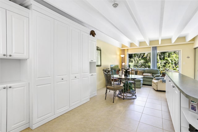 4001 S Ocean Blvd Unit 118, South Palm Beach, FL 33480 - living room with beam ceiling and light tile patterned floors
