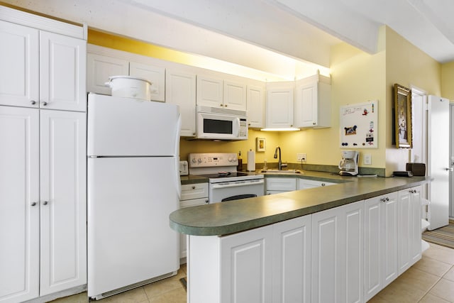 4001 S Ocean Blvd Unit 118, South Palm Beach, FL 33480 - kitchen with white appliances, light tile patterned floors, a sink, dark countertops, and white cabinets