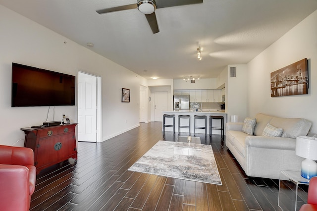 255 NE 3rd Ave Unit 2-516, Delray Beach, FL 33444 - living room featuring ceiling fan, dark wood-style flooring, and baseboards