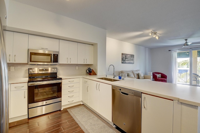 255 NE 3rd Ave Unit 2-516, Delray Beach, FL 33444 - kitchen with appliances with stainless steel finishes, a sink, light countertops, and open floor plan