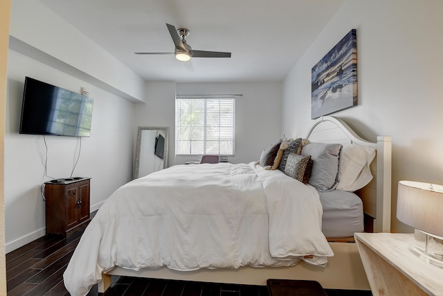 255 NE 3rd Ave Unit 2-516, Delray Beach, FL 33444 - bedroom featuring dark wood-style floors, a ceiling fan, and baseboards