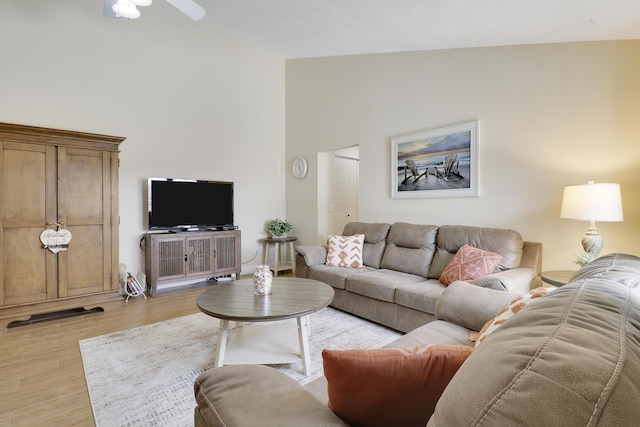 1801 S US Highway 1 Unit 7C, Jupiter, FL 33477 - living area featuring high vaulted ceiling, light wood-style floors, and a ceiling fan