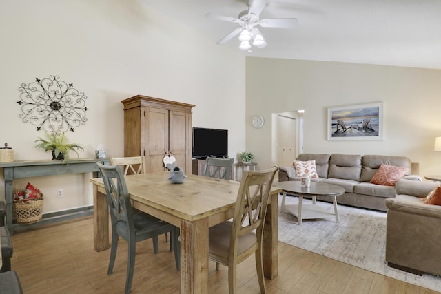 1801 S US Highway 1 Unit 7C, Jupiter, FL 33477 - dining room with high vaulted ceiling, light wood-type flooring, and ceiling fan