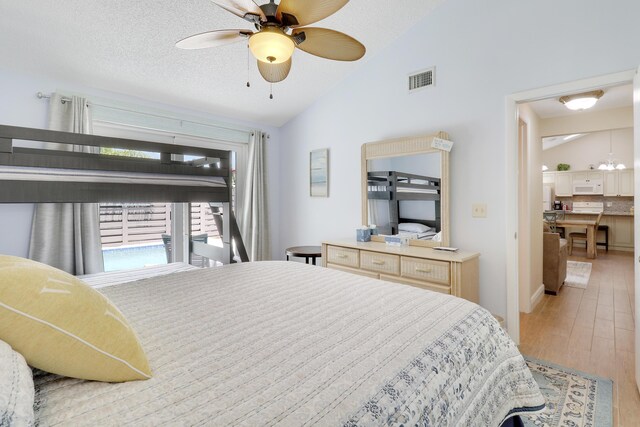 1801 S US Highway 1 Unit 7C, Jupiter, FL 33477 - bedroom featuring vaulted ceiling, wood finished floors, and ceiling fan