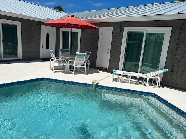 swimming pool with a patio area