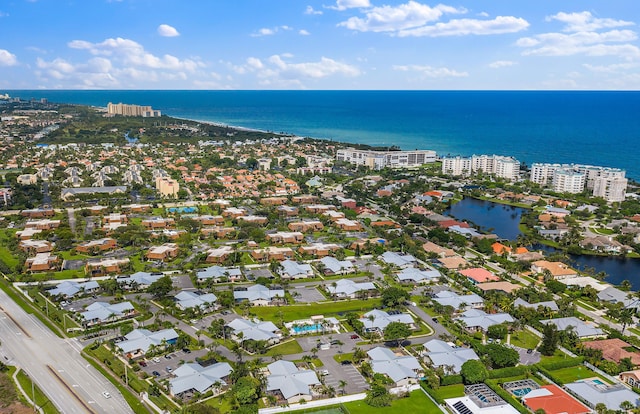 aerial view of residential area with a nearby body of water
