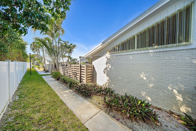 view of side of property with brick siding