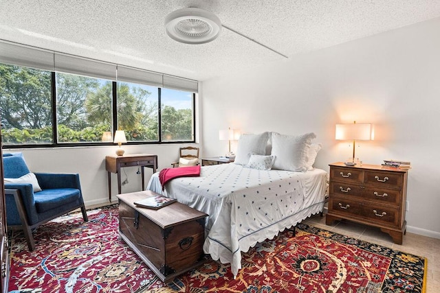 2520 Presidential Way Unit 203, West Palm Beach, FL 33401 - bedroom with a textured ceiling and baseboards